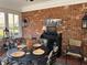 This sunroom has a brick accent wall and offers a serene space for relaxation and entertainment at 2392 Ivy Mountain Dr, Snellville, GA 30078