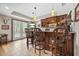 Cozy bar area featuring tile flooring, pendant lighting, and custom cabinets at 2431 Valhalla Ne Dr, Atlanta, GA 30345