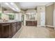 Spacious primary bathroom with dual vanities, granite counters and tile floors at 2431 Valhalla Ne Dr, Atlanta, GA 30345
