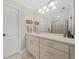 Well-lit bathroom with ample vanity storage, large mirror, and neutral color palette at 2431 Valhalla Ne Dr, Atlanta, GA 30345