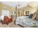 Bright bedroom featuring a four-poster bed, vaulted ceiling, TV, and sitting area at 2431 Valhalla Ne Dr, Atlanta, GA 30345