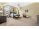 Spacious main bedroom with sitting area, four-poster bed, and large windows offering plenty of natural light at 2431 Valhalla Ne Dr, Atlanta, GA 30345