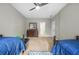Cozy bedroom with twin beds, wood furnishings, ceiling fan, and natural light at 2431 Valhalla Ne Dr, Atlanta, GA 30345