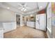 Bright bonus room featuring tile flooring, recessed lighting, plenty of cabinets, and a full-size refrigerator at 2431 Valhalla Ne Dr, Atlanta, GA 30345