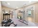 Home gym with exercise equipment and access to a bedroom and sunroom at 2431 Valhalla Ne Dr, Atlanta, GA 30345