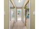 Neutral hallway with mirror closet doors featuring views into an attached bathroom and closet at 2431 Valhalla Ne Dr, Atlanta, GA 30345