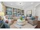Comfortable living room with stylish decor, built-in bookshelves and ample natural light at 2431 Valhalla Ne Dr, Atlanta, GA 30345