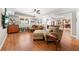Cozy living room area featuring hardwood floors, comfortable seating, and easy access to other areas of the house at 2431 Valhalla Ne Dr, Atlanta, GA 30345