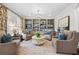 Cozy living room featuring built-in bookshelves, comfortable armchairs and a neutral color palette at 2431 Valhalla Ne Dr, Atlanta, GA 30345