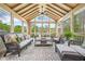 Cozy sunroom filled with natural light, comfortable seating, and elegant decor at 2431 Valhalla Ne Dr, Atlanta, GA 30345