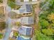 An aerial view of neighborhood homes with green trees, yards, and driveways at 2521 Capella Sw Cir, Atlanta, GA 30331