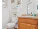 Charming half bath featuring beach decor and a classic vanity at 2521 Capella Sw Cir, Atlanta, GA 30331