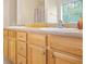 Bathroom with and sinks, wooden cabinetry, and a wide mirror for both to share at 2521 Capella Sw Cir, Atlanta, GA 30331