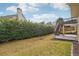 Backyard view with upper deck and covered patio area at 2615 Springmonte Pl, Cumming, GA 30041