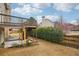 View of backyard, covered patio and back deck at 2615 Springmonte Pl, Cumming, GA 30041
