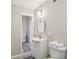 Bathroom with white vanity, updated fixtures, and tile flooring at 2615 Springmonte Pl, Cumming, GA 30041