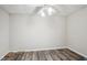 Cozy bedroom featuring updated flooring, ceiling fan, textured ceiling and ample natural light at 2615 Springmonte Pl, Cumming, GA 30041