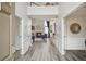 Elegant foyer with hardwood floors, a view of the staircase, and an open view into the living room at 2615 Springmonte Pl, Cumming, GA 30041