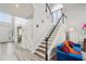 Welcoming foyer featuring stairs to the upper level, high ceilings, and bright decor at 2615 Springmonte Pl, Cumming, GA 30041