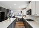 A bright kitchen features a stone countertop island, stainless steel appliances, and a gas range at 2615 Springmonte Pl, Cumming, GA 30041