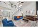Spacious living room with a staircase, high ceilings, and an inviting seating arrangement at 2615 Springmonte Pl, Cumming, GA 30041