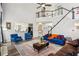 Bright living room features a high ceiling, large windows, and comfortable furnishings at 2615 Springmonte Pl, Cumming, GA 30041