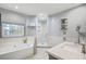 Luxurious bathroom boasts a soaking tub, walk-in shower, and modern vanity at 4831 Lake Park Ter, Acworth, GA 30101
