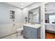 Modern bathroom featuring gray vanity, marble floors, and views to the adjacent bedroom at 4831 Lake Park Ter, Acworth, GA 30101