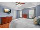 Spacious bedroom featuring a ceiling fan, wood floors, and plenty of natural light at 4831 Lake Park Ter, Acworth, GA 30101