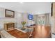 Bright living room featuring a decorative fireplace, hardwood floors, and access to a patio at 4831 Lake Park Ter, Acworth, GA 30101