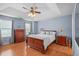 Main bedroom features a tray ceiling, natural light, and wood furnishings at 4831 Lake Park Ter, Acworth, GA 30101