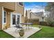 Backyard patio featuring a table and chairs with a well maintained grassy yard at 4831 Lake Park Ter, Acworth, GA 30101