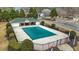 Community pool covered for the winter with an adjacent recreation center and surrounding greenery at 4831 Lake Park Ter, Acworth, GA 30101