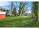 Expansive backyard with lush green grass and mature trees at 732 Cascade Ave, Atlanta, GA 30310