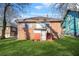 The backyard of a brick house with grass at 732 Cascade Ave, Atlanta, GA 30310