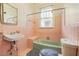 Vintage bathroom featuring pink tile, and a tub with a shower at 732 Cascade Ave, Atlanta, GA 30310
