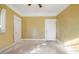 Bedroom with ceiling fan, two doors, and light-colored walls at 732 Cascade Ave, Atlanta, GA 30310