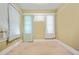 Bedroom includes carpet and 3 windows for natural light at 732 Cascade Ave, Atlanta, GA 30310