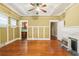Living room features hardwood floors, a ceiling fan, with a view into the kitchen at 732 Cascade Ave, Atlanta, GA 30310