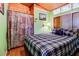 Quaint bedroom with wood paneling, charming decor, and comfortable queen-sized bed at 5 Yachting Way, Acworth, GA 30102