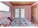Well-lit bedroom with bed, neutral walls, exterior doors and wooden accents at 5 Yachting Way, Acworth, GA 30102