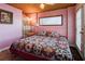 Comfortable bedroom with an exterior door and a patterned quilt at 5 Yachting Way, Acworth, GA 30102
