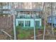Inviting lake house with a spacious deck, perfect for outdoor relaxation and enjoying the serene views at 5 Yachting Way, Acworth, GA 30102