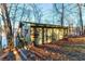 Exterior of home set among mature trees with water view at 5 Yachting Way, Acworth, GA 30102