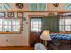 Cozy living room featuring hardwood floors, nautical decor, and a charming Dutch door with lake view at 5 Yachting Way, Acworth, GA 30102