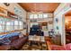 Comfortable living room with wood-paneled ceiling, entertainment center, and inviting seating area at 5 Yachting Way, Acworth, GA 30102