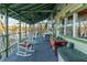 Relax on this comfortable screened porch with rocking chairs and lake views at 5 Yachting Way, Acworth, GA 30102