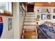 Unique stairway to the upper level with wooden steps and adjacent living area at 5 Yachting Way, Acworth, GA 30102