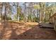 Large backyard featuring mature trees, a deck, and ample space for outdoor enjoyment and landscaping at 508 Greenridge Cir, Stone Mountain, GA 30083