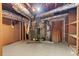 Unfinished basement with exposed ductwork, shelving, and essential utilities needing updating at 508 Greenridge Cir, Stone Mountain, GA 30083